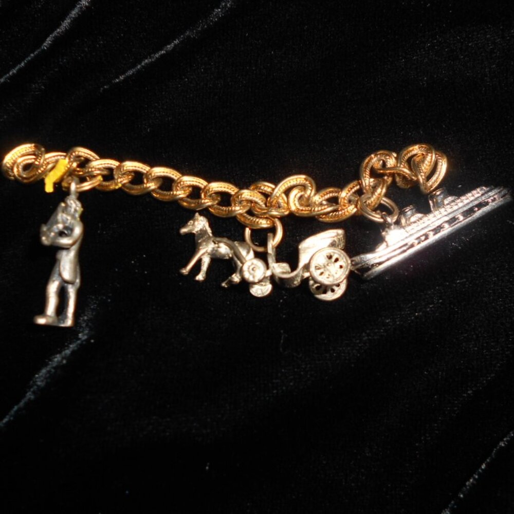 Three Vintage Charms - one sterling
